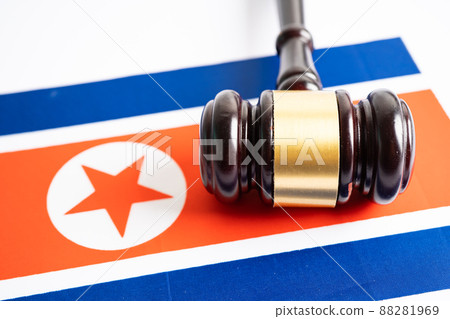 North Korea flag with gavel for judge lawyer. Law and justice court concept. North Korea flag with gavel for judge lawyer. Law and justice court concept. 88281969