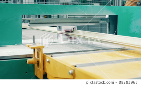 Factory press with a fiberglass frame moving through it 88283963