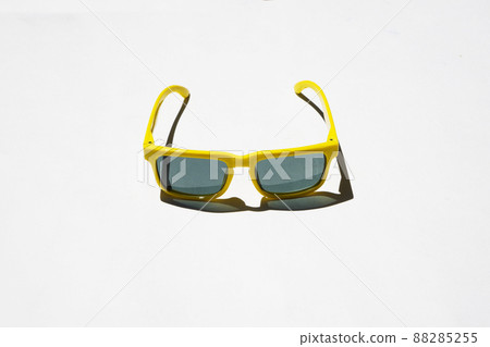 yellow sunglasses pattern on white pastel background. Minimal summer concept. Isometric print yellow sunglasses pattern on white pastel background. Minimal summer concept. Isometric print 88285255