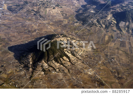 Mexico guadalajara fields and volcanos aerial view panorama landscape from airplane while flying from mexico city Mexico guadalajara fields and volcanos aerial view panorama landscape from airplane while flying from mexico city 88285917