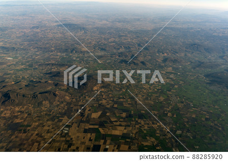 Mexico guadalajara fields and volcanos aerial view panorama landscape from airplane while flying from mexico city 88285920
