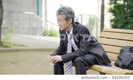 A businessman twilight in the park 88286262