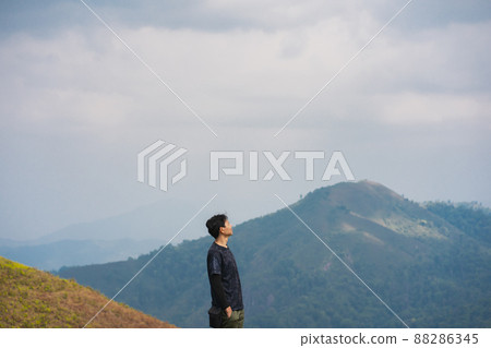 solo backpacker man happy and joyful after success climb the mountain solo backpacker man happy and joyful after success climb the mountain 88286345