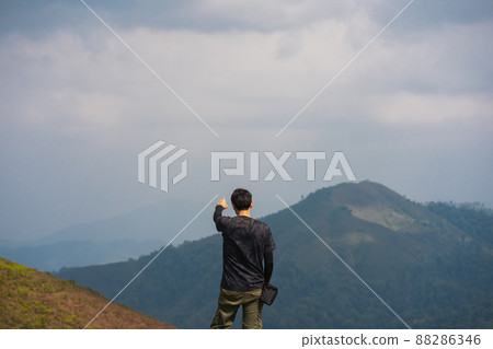 solo backpacker man happy and joyful after success climb the mountain solo backpacker man happy and joyful after success climb the mountain 88286346