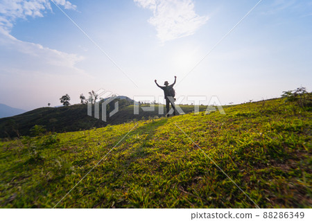 solo backpacker man happy and joyful after success climb the mountain solo backpacker man happy and joyful after success climb the mountain 88286349