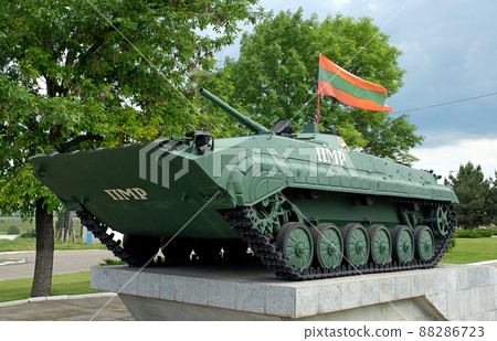 Bender near Tiraspol, Transnistria, Moldova: Close up of the Tank Monument at the Memorial of Military Glory in Bender. The tank flies the Transnistria flag and is set in a city park. Bender near Tiraspol, Transnistria, Moldova: Close up of the Tank Monument at the Memorial of Military Glory in Bender. The tank flies the Transnistria flag and is set in a city park. 88286723