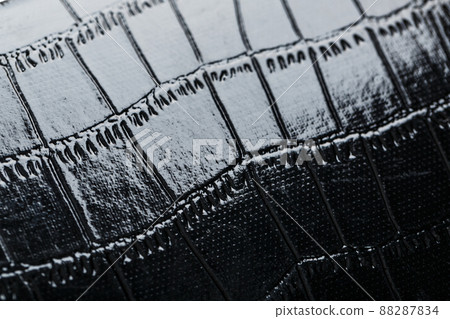 Texture of black crocodile skin in the background in full screen 88287834