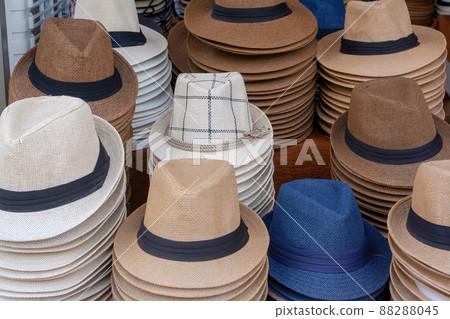 Stacks of mens hats on street counter. Stacks of mens hats on street counter. 88288045