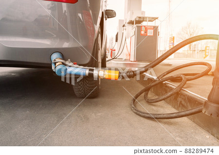 Fuel car. Pump petrol from nozzle in vehicle tank. Gasoline, oil gas station. Economy business with diesel transport. Automotive transportation concept. Fuel car. Pump petrol from nozzle in vehicle tank. Gasoline, oil gas station. Economy business with diesel transport. Automotive transportation concept. 88289474