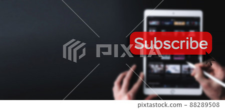Subscribe button. Online video subscription red button. Internet service on laptop digital tablet blured banner background. Visual contents concept. Social networking service. 88289508