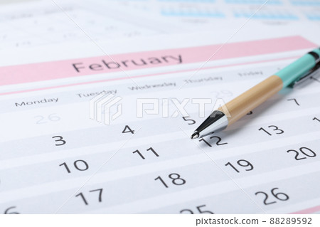 Pen on calendar page, closeup. Planning concept 88289592