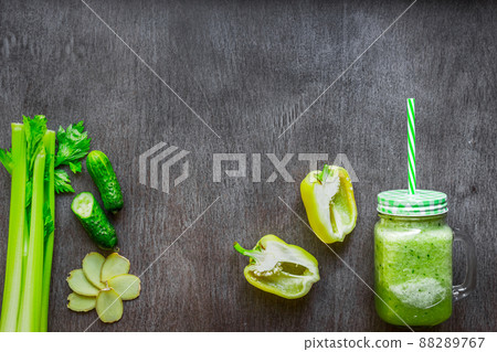 Green vegetable smoothie with celery, ginger and cucumber Green vegetable smoothie with celery, ginger and cucumber 88289767