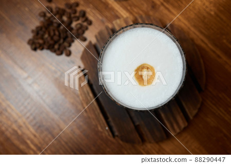 Cup of coffee on wooden table, top view. Cup of coffee on wooden table, top view. 88290447