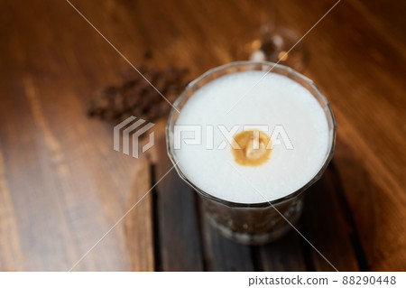 Cup of coffee on wooden table, top view. Cup of coffee on wooden table, top view. 88290448