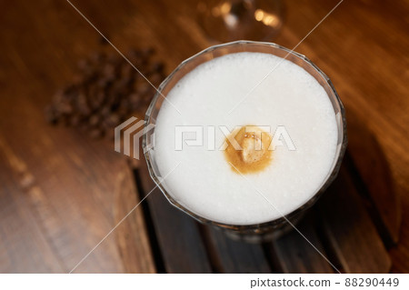 Cup of coffee on wooden table, top view. Cup of coffee on wooden table, top view. 88290449