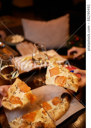 Celebrating with glasses of alcohol in hands. Happy female friends having good time. Celebrating with glasses of alcohol in hands. Happy female friends having good time. 88290491