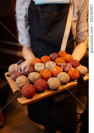 Belper Knolle cheese in the form of small balls. Small Swiss hard cheese balls Belper Knolle. Swiss cheese delicacy concept. Selective focus. 88290867