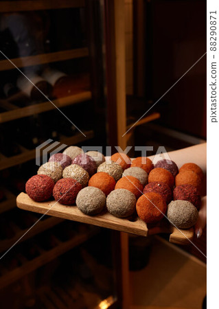 Belper Knolle cheese in the form of small balls. Small Swiss hard cheese balls Belper Knolle. Swiss cheese delicacy concept. Selective focus. 88290871