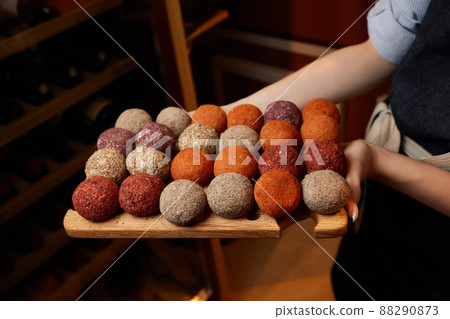 Belper Knolle cheese in the form of small balls. Small Swiss hard cheese balls Belper Knolle. Swiss cheese delicacy concept. Selective focus. 88290873