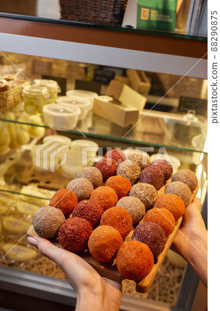 Belper Knolle cheese in the form of small balls. Small Swiss hard cheese balls Belper Knolle. Swiss cheese delicacy concept. Selective focus. 88290875