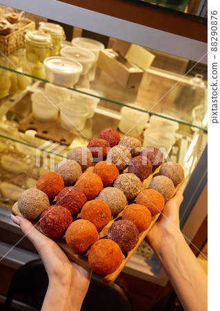 Belper Knolle cheese in the form of small balls. Small Swiss hard cheese balls Belper Knolle. Swiss cheese delicacy concept. Selective focus. 88290876