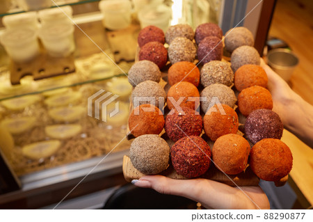 Belper Knolle cheese in the form of small balls. Small Swiss hard cheese balls Belper Knolle. Swiss cheese delicacy concept. Selective focus. 88290877