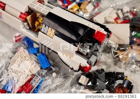 assembling a rocket constructor. colored plastic small blocks. 88291361