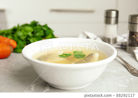 Delicious fish soup served on marble table Delicious fish soup served on marble table 88292117