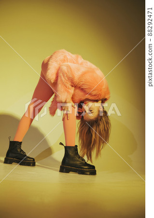 Fashion model in pink suit. Studio shot. Film edit Fashion model in pink suit. Studio shot. Film edit 88292471