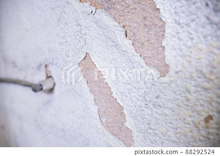 White paint sprayed wall peeling cracks White paint sprayed wall peeling cracks 88292524