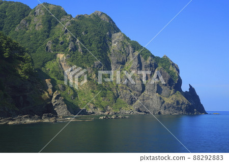 Benkei's sword-hanging rock in midsummer in Iwanai-cho, Hokkaido Benkei's sword-hanging rock in midsummer in Iwanai-cho, Hokkaido 88292883