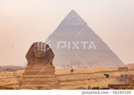 View of Sphinx in The Giza Plateau with The Great Pyramid of Giza in the background. View of Sphinx in The Giza Plateau with The Great Pyramid of Giza in the background. 88293109