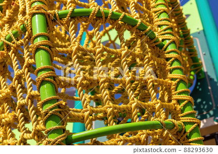 Yellow rope on green, metal pipes Yellow rope on green, metal pipes 88293630