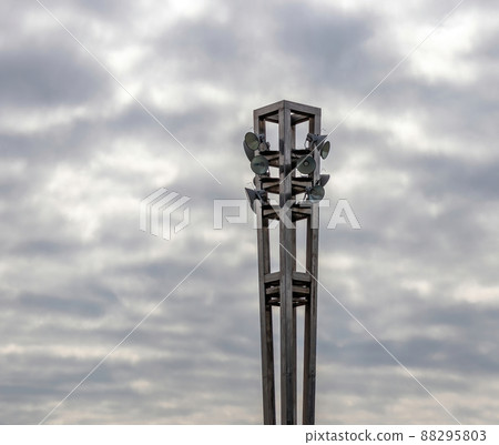 A metal lamp post with various lights. A metal lamp post with various lights. 88295803
