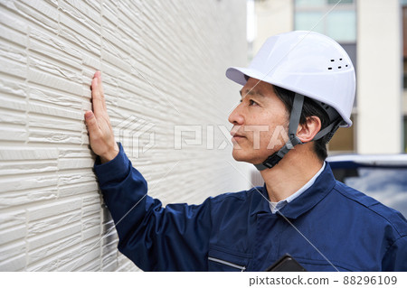 Businessman siding in work clothes 88296109