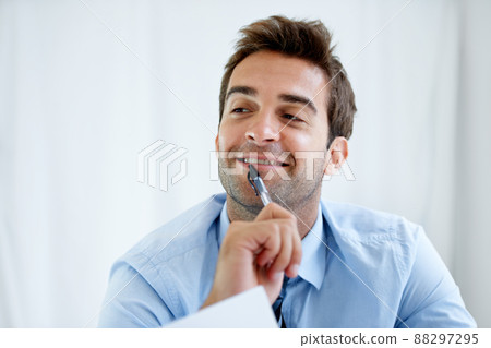 The modern professional. Cropped shot of a handsome young businessman at work. 88297295