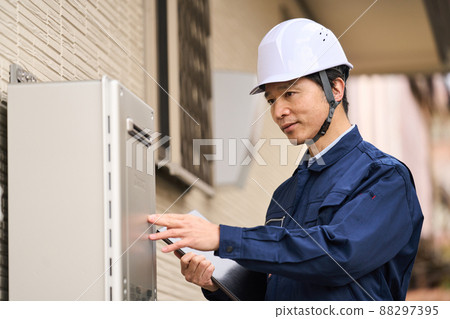 Businessman wearing work clothes Water heater 88297395