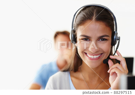 How can I help you today. Closeup of an attractive young woman using a headset. How can I help you today. Closeup of an attractive young woman using a headset. 88297515