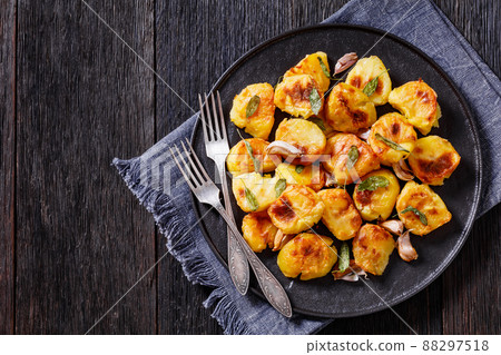 roasted squashed potatoes with garlic and sage roasted squashed potatoes with garlic and sage 88297518