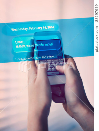 A cropped shot of of someone texting a friend on their smart phone. All screen content is designed by us and not copyrighted by others, and upon purchase a user license is granted to the purchaser. A 88297659