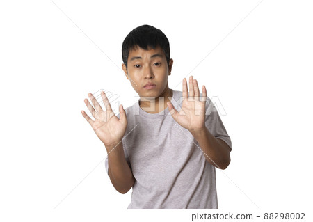 Portrait of young man show stop gesture sign by hand. Portrait of young man show stop gesture sign by hand. 88298002