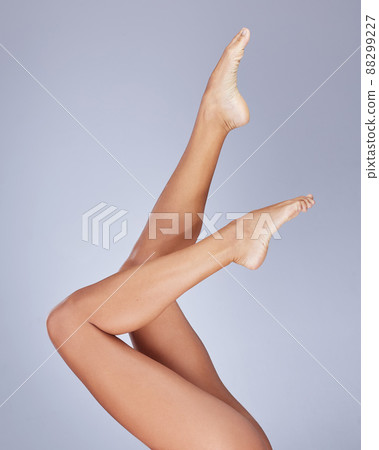 Loving every inch of my body. Cropped shot of an unrecognizable woman showing her legs while posing in the studio. 88299227