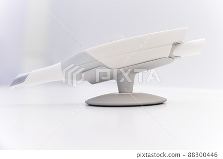Dental intraoral scanner isolated on table in bright dentist office. Dentistry and health care concept. Close up. 88300446