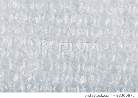 The texture of the packaging air-bubble film on a White background in full screen The texture of the packaging air-bubble film on a White background in full screen 88300673