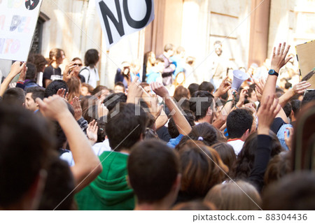 Power to the people. Rearview shot of a crowd protesting outside a public building. 88304436