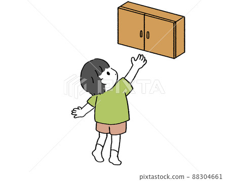 A boy trying to reach for a cupboard A boy trying to reach for a cupboard 88304661