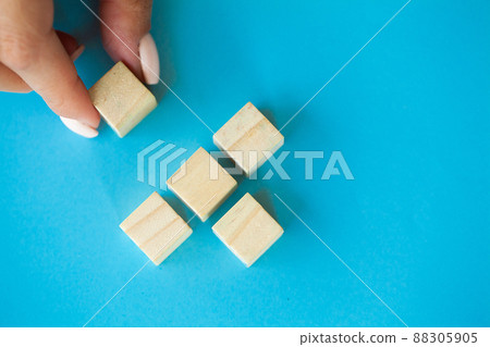Hand arranging wood block with empty space. 88305905