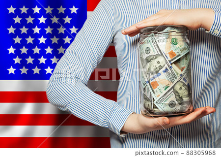 Banknotes of american dollar on national USA flag background Banknotes of american dollar on national USA flag background 88305968