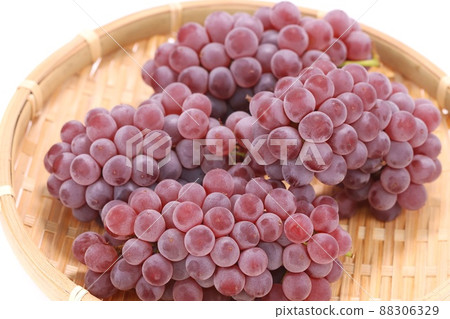 Delaware small grapes reddish purple bright background Delaware small grapes reddish purple bright background 88306329