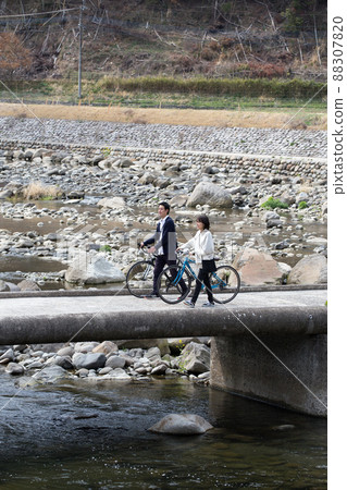 Walk across the sinking bridge by bicycle Walk across the sinking bridge by bicycle 88307820